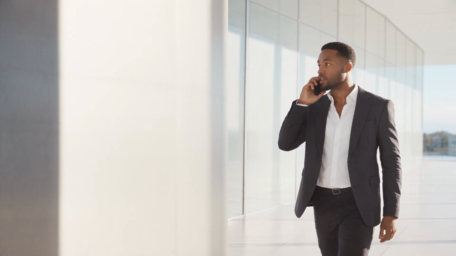 Business executive speaking to his agent by phone